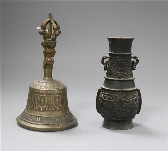 A Chinese archaistic bronze vase and a ghanta bell 12 and 15cm high